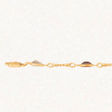 Bracciale vintage in oro giallo 18K con granati, ametiste, acquamarina, spinello blu sintetico e zaffiro bianco, anni ‘70