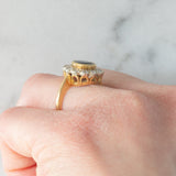 Anello a margherita vintage in oro 18K con zaffiro (1.10ct ca.) e diamanti di taglio brillante (0.50ctw ca.), anni ‘60