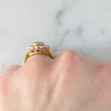 Anello a margherita vintage in oro 18K con zaffiro (1.10ct ca.) e diamanti di taglio brillante (0.50ctw ca.), anni ‘60