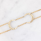Vintage 18K yellow gold and silver semi-rigid bracelet with crescent-shaped decorations and rose-cut diamonds, 50s