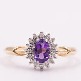Anello a margherita vintage in oro giallo 9K con ametista (0.40ct ca.) e diamanti (0.16ctw ca.), anni ‘80/‘90