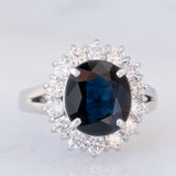 Anello a margherita vintage in platino con zaffiro (4.30ct) e diamanti (1.05ctw), anni ‘80