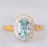 Anello a margherita in oro giallo 9K con zircone azzurro (1.83ct ca.) e zirconi bianchi
