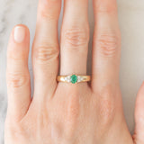 Vintage 9K yellow gold band ring with emerald (0.25ct approx.) and diamonds (0.12ctw approx.)