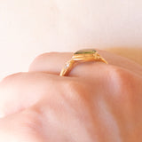 Vintage 18K yellow gold ring with peridot (0.75ct approx.) and diamonds (0.06ctw approx.), 70s/80s