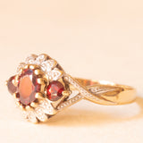 Vintage-Ring aus 9-karätigem Gelb- und Weißgold mit Granaten (ca. 0.70 ctw) und Diamanten, 60er Jahre
