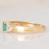 Vintage 9K yellow gold band ring with emerald (0.25ct approx.) and diamonds (0.12ctw approx.)