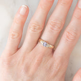 Vintage 9K yellow gold band ring with tanzanite (0.40ct approx.) and diamonds (0.12ctw approx.), year 2004