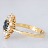 Anello a margherita navette in oro giallo 18K con zaffiro (1ct ca.) e diamanti di taglio brillante (0.75ctw ca.), anni ‘60/‘70