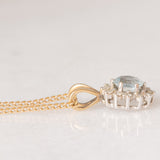 Collana vintage con catenina in oro giallo 9K e con ciondolo a margherita in oro giallo 9K con acquamarina (0.30ct ca.) e diamanti (0.06ctw ca.)