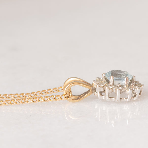 Collana vintage con catenina in oro giallo 9K e con ciondolo a margherita in oro giallo 9K con acquamarina (0.30ct ca.) e diamanti (0.06ctw ca.)