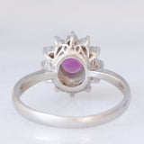 Anello a margherita vintage in platino con rubino (0.62ct) e diamanti (0.36ctw), anni ‘70/‘80