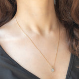 Collana vintage con catenina in oro giallo 9K e con ciondolo a margherita in oro giallo 9K con acquamarina (0.30ct ca.) e diamanti (0.06ctw ca.)