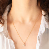 Vintage-Halskette mit Kette aus 9-karätigem Gelbgold und Anhänger aus 9-karätigem Gelb- und Weißgold mit blauem Topas im Herzschliff (ca. 0.60 ct), ca. 90er Jahre.