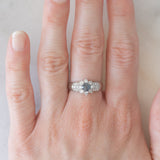 Vintage platinum daisy ring with color-change garnet (approx. 0.35ct) and diamonds (0.58ctw)