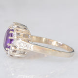 Anello a margherita vintage in oro bianco 14K con ametista (0.70ct ca.) e diamanti (0.50ctw ca.), anni ‘70