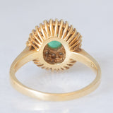 Anello ballerina vintage in oro giallo 14K con smeraldo (0.50ct ca.) e diamanti di taglio brillante e di taglio tapered (0.50ctw ca.), anni ‘70