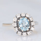 Bague marguerite vintage en or blanc 14 carats avec aigue-marine (environ 0.70 ct) et diamants taille brillant (environ 0.24 ct), années 70