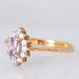Anello a margherita in oro giallo 9K con zaffiro viola sintetico (0.25ct) e zirconi bianchi