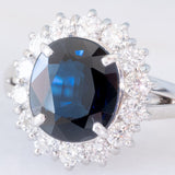 Anello a margherita vintage in platino con zaffiro (4.30ct) e diamanti (1.05ctw), anni ‘80