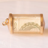 Colgante vintage para dinero de emergencia con forma de cilindro de plástico, oro amarillo de 9 quilates y billete de libra, 1978