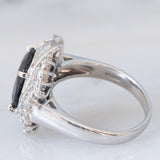 Anello a margherita vintage in platino con zaffiro (4.74ct) e diamanti (0.86ctw), anni ‘80