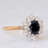 Anello a margherita vintage in oro giallo 9K con zaffiro (1ct ca.) e diamanti di taglio brillante (0.33ctw ca.), anno 1987