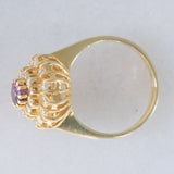 Anello a fiore vintage in oro giallo 14K con rubino (1ct ca.) e diamanti di taglio brillante (0.70ctw ca.), anni ‘70