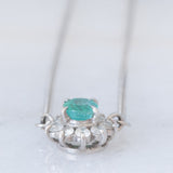 Collier vintage in platino con ciondolo a margherita con smeraldo (0.35ct) e diamanti (0.23ctw)