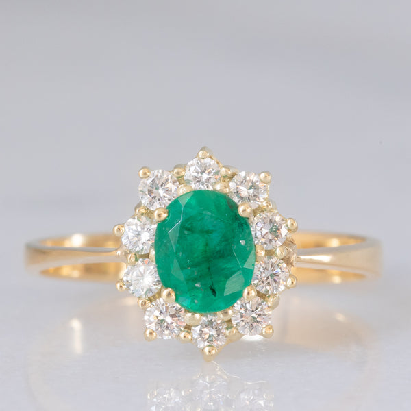 Anello a margherita vintage in oro giallo 18K e 14K con smeraldo (0.60ct ca.) e diamanti di taglio brillante (0.30ctw ca.), anni ‘70/‘80