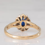 Anello a margherita vintage in oro giallo e bianco 9K con zaffiro (0.60ct ca.) e diamanti (0.12ctw ca.), anno 1991