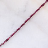 Collana moderna con granati, perla bianca e oro giallo 14K