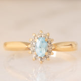 Bague marguerite vintage en or jaune 9 carats avec topaze bleue (0.30 ct environ) et diamants (0.06 ct environ), années 80