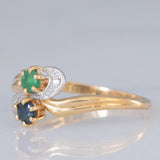 Toi et Moi vintage in oro giallo 18K con zaffiro (0.09ct ca.), smeraldo (0.06ct ca.) e diamanti, anni ‘70/‘80