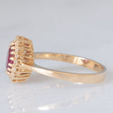 Anello a margherita vintage in oro giallo 14K con rubino (1.50ct ca.) e diamanti (0.16ctw ca.), anni ‘70/‘80