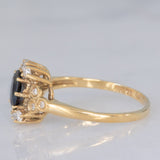 Anello a margherita vintage in oro giallo 14K con zaffiro (0.70ct ca.) e diamanti (0.20ctw ca.), anni ‘80