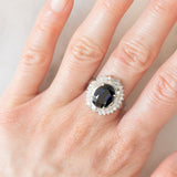 Anello a margherita vintage in platino con zaffiro (4.74ct) e diamanti (0.86ctw), anni ‘80