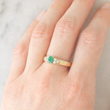 Vintage 9K yellow gold band ring with emerald (0.25ct approx.) and diamonds (0.12ctw approx.)