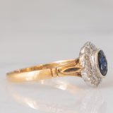 Anello a margherita vintage in oro giallo e bianco 9K con zaffiro (0.60ct ca.) e diamanti (0.12ctw ca.), anno 1991