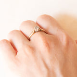 Solitärring aus 9 Karat Gelb- und Weißgold mit Diamant im Brillantschliff (ca. 0.10 ct), 70er Jahre