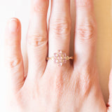 Vintage 10K yellow gold flower ring with synthetic pink sapphires (approx. 1.20ctw) and white sapphires, 1992