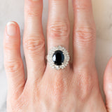 Anello a margherita vintage in platino con zaffiro (4.74ct) e diamanti (0.86ctw), anni ‘80