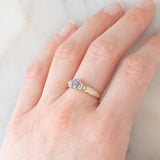 Vintage 9K yellow gold band ring with tanzanite (0.40ct approx.) and diamonds (0.12ctw approx.), year 2004