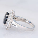 Anello a margherita vintage in platino con zaffiro (4.30ct) e diamanti (1.05ctw), anni ‘80