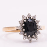 Anello a margherita vintage in oro giallo 9K con zaffiro (1.33ct ca.) e diamanti (0.12ctw ca.), anno 1985