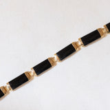 Halbstarres Vintage-Onyx-Armband aus 14-karätigem Gelbgold mit chinesischem Schriftverschluss aus 14-karätigem Gelbgold, 70er Jahre