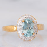 Anello a margherita in oro giallo 9K con zircone azzurro (1.83ct ca.) e zirconi bianchi