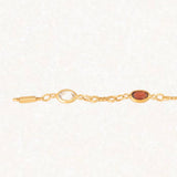 Bracciale vintage in oro giallo 18K con granati, ametiste, acquamarina, spinello blu sintetico e zaffiro bianco, anni ‘70