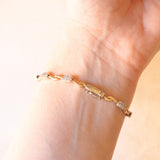 Bracciale semirigido vintage in oro giallo e bianco 18K con pavé di diamanti di taglio brillante (0.50ctw ca.)