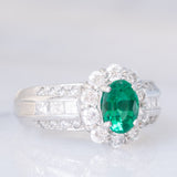 Anello a fiore vintage in platino con smeraldo (0.81ct) e diamanti (0.93ctw), anni ‘80